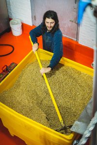 Philadelphia Brewing Co: Chris with spent grains from the tank